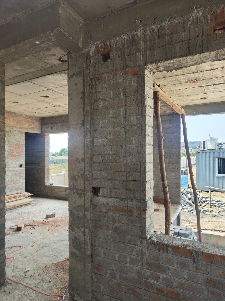 RCC frame and blockwork interior during construction in Navalur, Chennai