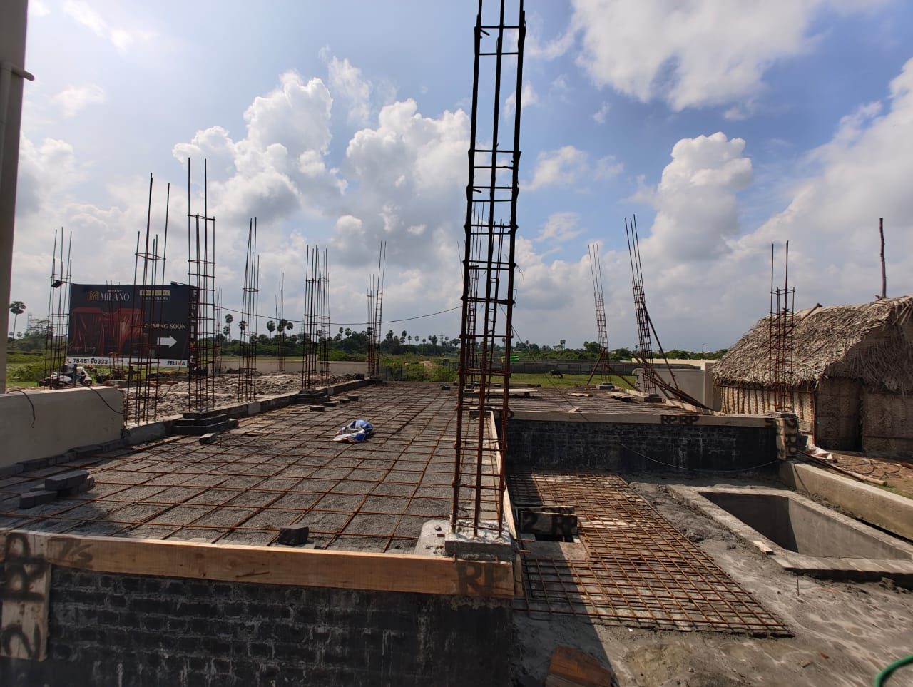 Roof slab reinforcement and column starters during construction in Navalur, Chennai